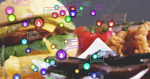 Icons drifting into frame, shot panning and zooming toward burger and fries, showing social buzz