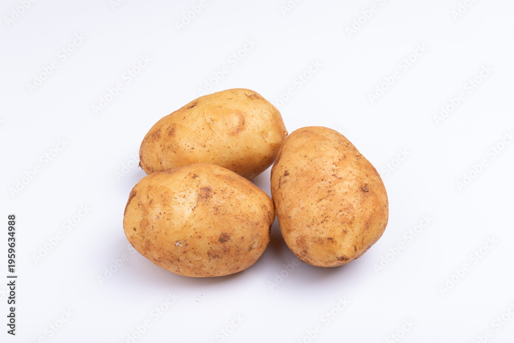 Fototapeta premium Fresh potatoes on a white background