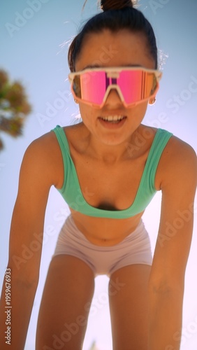 Caucasian woman leaning forward with confident coaching presence