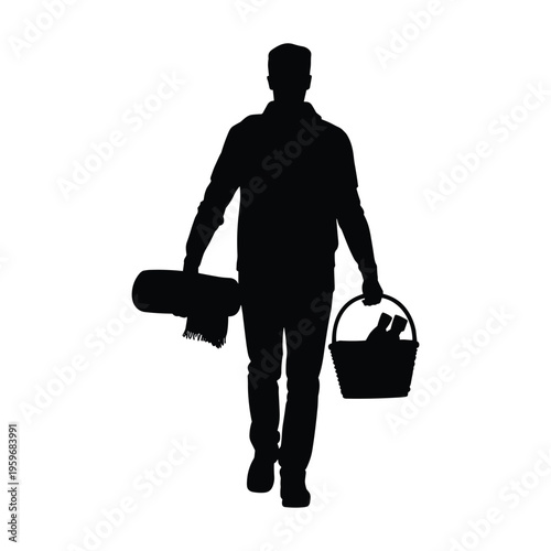 Man carrying picnic basket and blanket silhouette