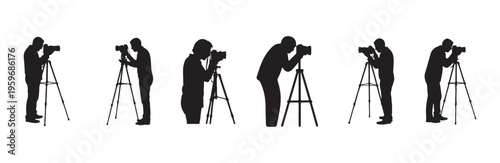 Photographer silhouettes with cameras on tripods adjusting equipment and shooting