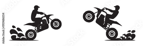 Silhouette quad bike rider doing wheelie splashing mud extreme