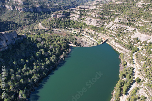 Drone view of Margalef reservoir on sunny winter day. Tarragona Province, Spain.