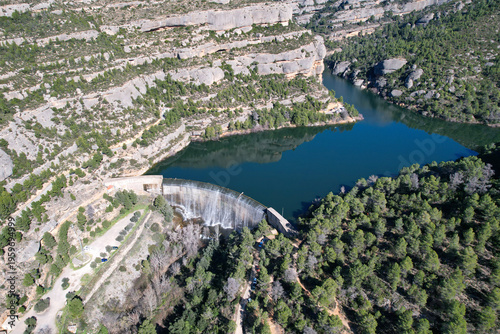 Drone view of Margalef dam on sunny winter day. Tarragona Province, Spain.