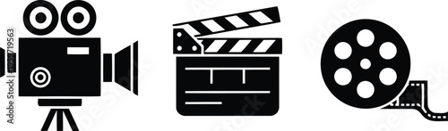 A film crew prepares for a cinematic production with a camera, clapperboard, and film reel.