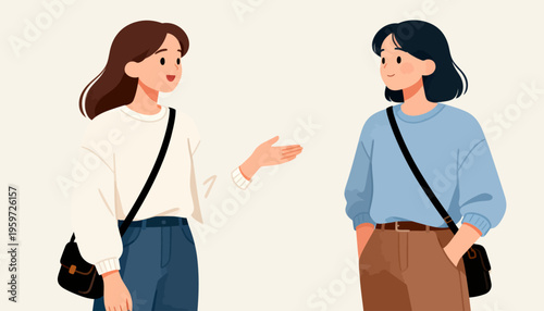 Two women converse with warm smiles. One gestures gently, suggesting shared ideas. Both carry crossbody bags, dressed casually. Friendly chat implies teamwork or friendship