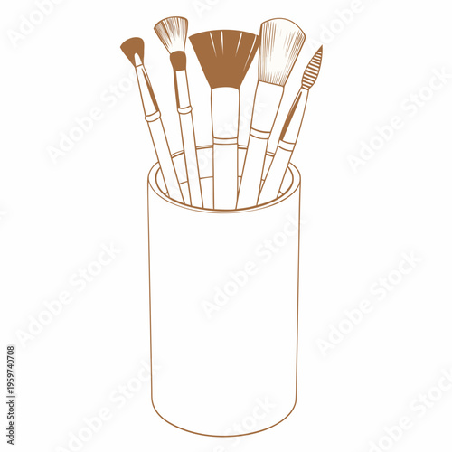 A collection of makeup brushes displayed in a cylindrical container