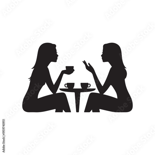 Two women sitting at a small table drinking coffee together in silhouette