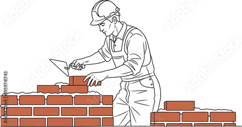 Construction worker building a brick wall with a trowel and hard hat on