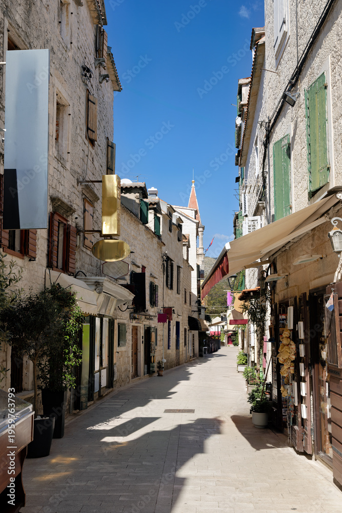 Fototapeta premium Side street in Trogir with typical architecture, in Dalmatia in late summer