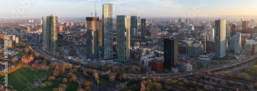Aerial Panorama of New Jackson Skyscraper District in Manchester UK and Hulme Park at Sunrise. 