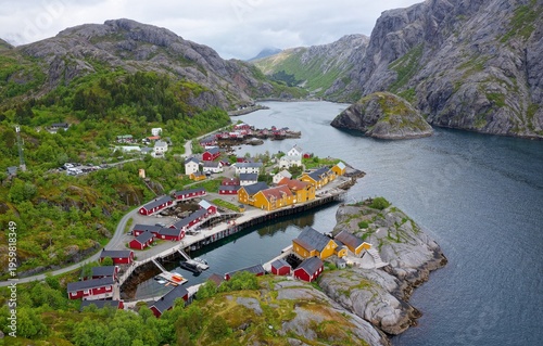 Wallpaper Mural Nusfjord is one of Norway's oldest fishing villages in the Lofoten Islands. Its vibrant red and yellow cabins sit between steep peaks and emerald waters, forming a stunning "living postcard Torontodigital.ca