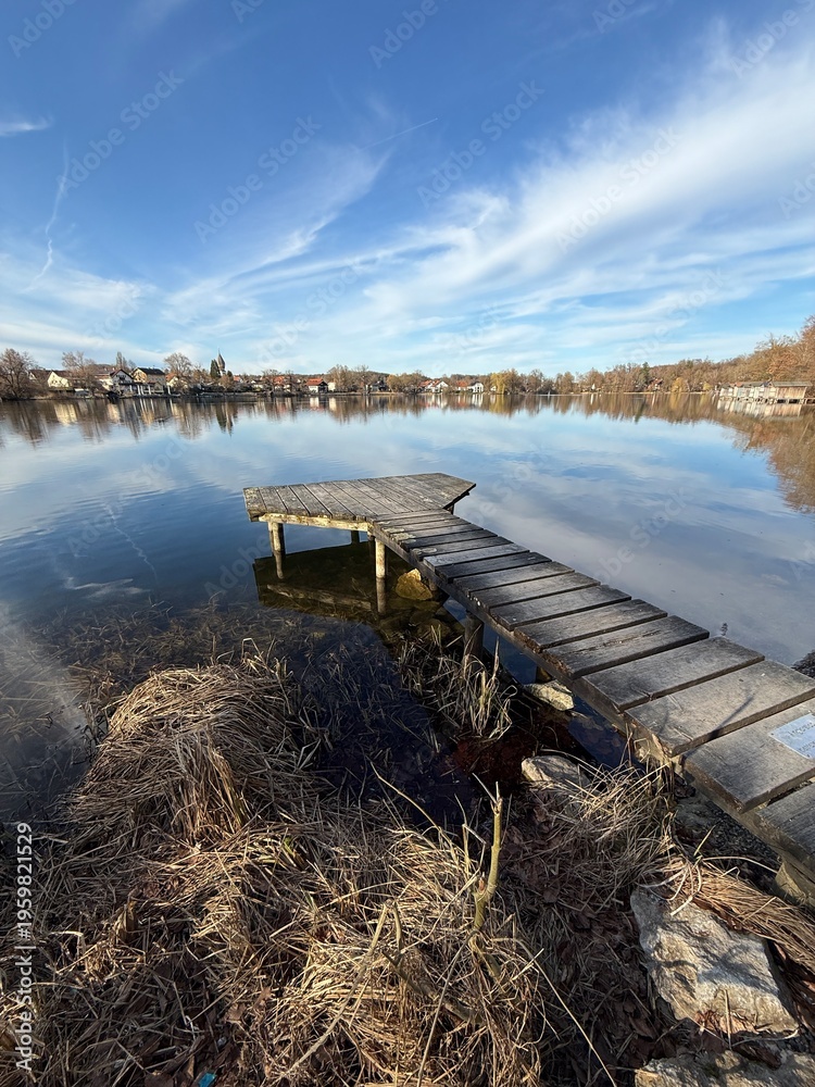 Fototapeta premium idyllic landscape with wooden pier over the beautiful lake