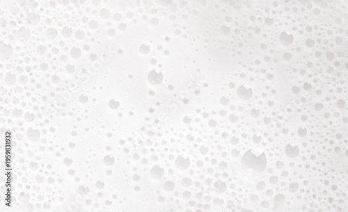 Texture of white soap foam with bubbles abstract background.