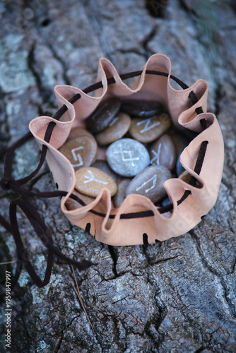 a set of stone runes in a pouch