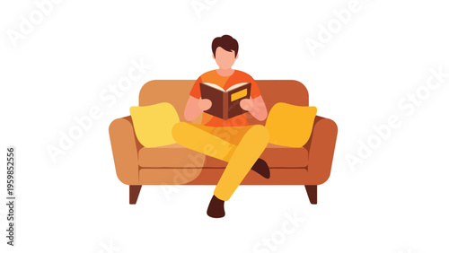 A man sits on a couch reading a book with a relaxed posture and casual attire.
