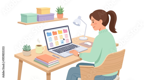 Young woman working diligently on her laptop at a desk.