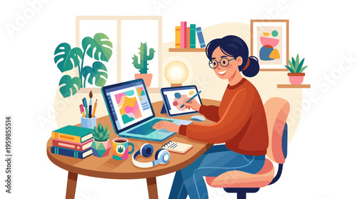 Young woman working on laptop and tablet at home office.