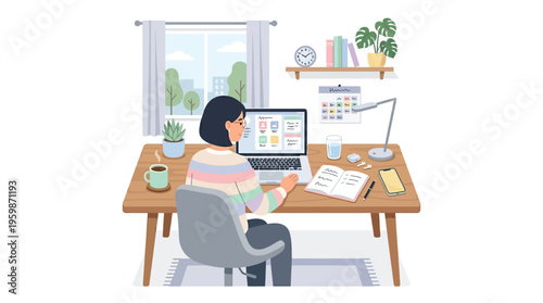 Woman working diligently at her home office desk.