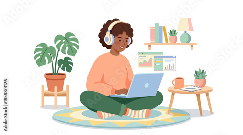 Young person wearing headphones using a laptop computer.