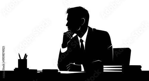 Silhouette of a thoughtful businessman sitting at his desk, contemplating a decision.
