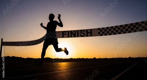 Silhouette of a runner crossing the finish line at sunset, achieving victory.