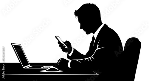 Silhouette of businessman using smartphone at desk with laptop and mouse