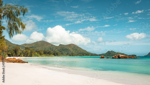 White sand beach with granite boulders at Anse Gouvernement, Praslin, Seychelles