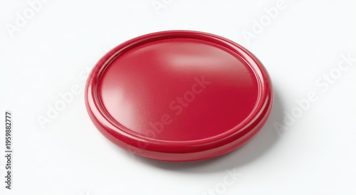 A close-up studio shot showcases a vibrant red, circular object with a raised rim, set against a pristine white background