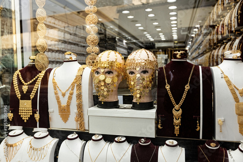 Golden shop window display traditional arabic face mask jewelry old town of Jeddah Saudi Arabia