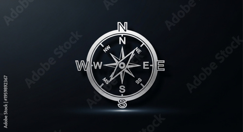 Silver Compass Rose with Cardinal Directions on Dark Background.