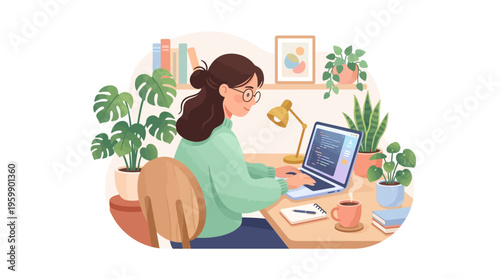 Young woman working diligently on her laptop at a desk.