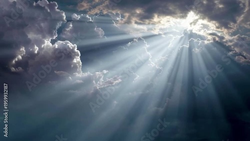 A serene video of sunbeams shining through clouds in a blue sky