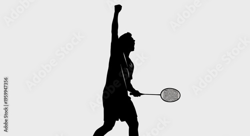 Silhouette of a badminton player celebrating a victory with a raised arm and racket against a plain background.