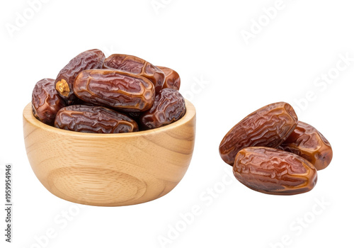 Dates in a wooden bowl and some loose on transparent background