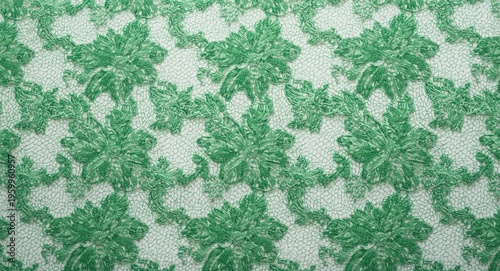 Green lace textile featuring elaborate floral motifs on white surface ideal for accents