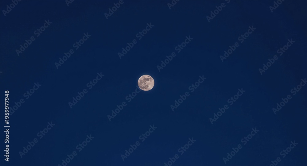 Fototapeta premium Full moon glowing brightly in an empty sky