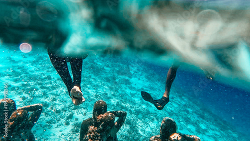 Wallpaper Mural Bask Nest underwater art installation with vibrant fish at Gili Meno dive site Torontodigital.ca