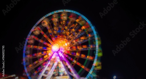 Abstract blurred ferris wheel lights in multi colors with copy space for graphic design