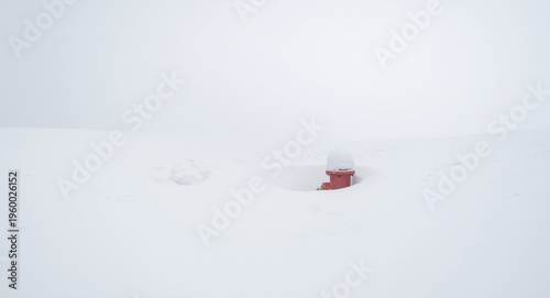 Fire hydrant nearly invisible under heavy snow cover
