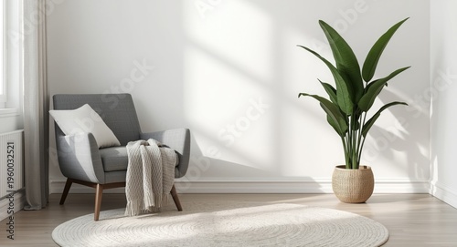 Modern bedroom interior featuring minimalist gray armchair, soft blanket, and green plant pot