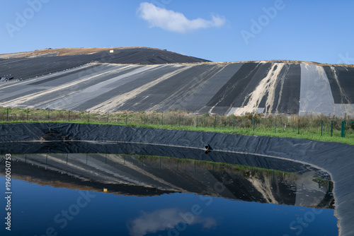 Quadro su tela Modern landfill under blue skies