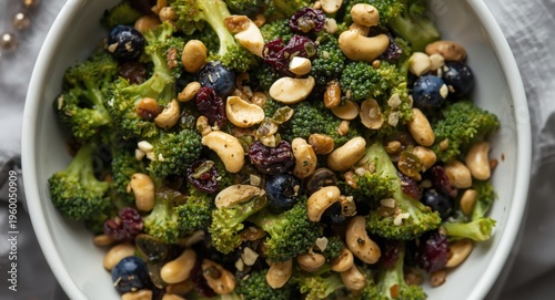 Fresh broccoli salad with peanuts and dried blueberries in a vinaigrette dressing