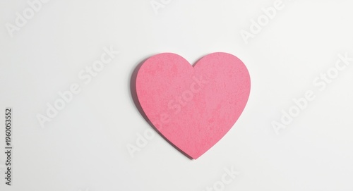 heart shaped sticky note on white background with soft daylight and copy space