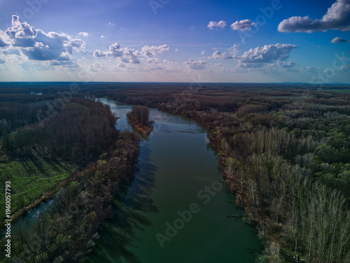 Aerial view of the Danube floodplains and wetlands in Dunajske luhy protected area near Bratislava, Slovakia. Lush forests and river branches at the Slovak-Hungarian border.