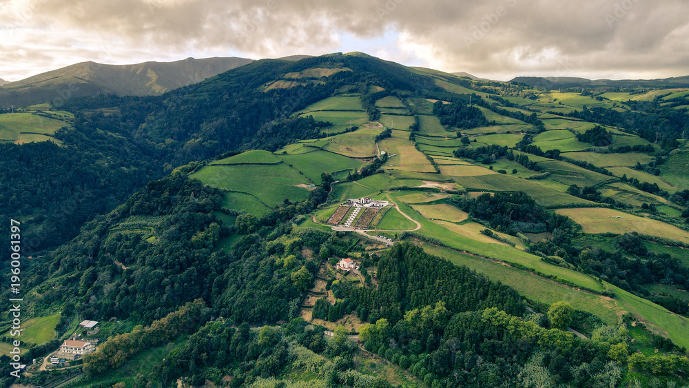 Fototapeta premium Beautiful aerial drone view of the Church of Our Lady of Peace (Nossa Senhora da Paz) overlooking Vila Franca do Campo on São Miguel Island in the Azores, Portugal. 