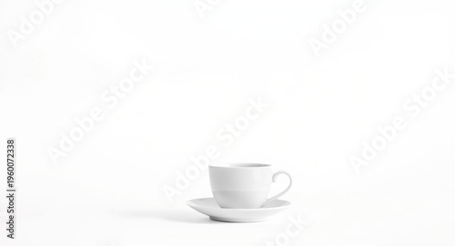 Delicate monochrome tea cup positioned on a bright white minimal backdrop with copy space