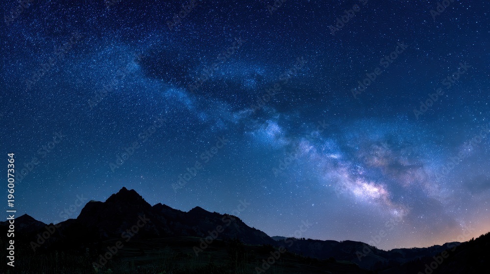 Obraz premium Starry Roadmap: Milky Way Arc and Cassiopeia in a Deep Blue Night Sky
