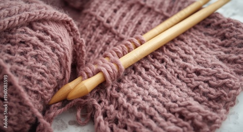 Handmade scarf project including chunky yarn and giant knitting needles