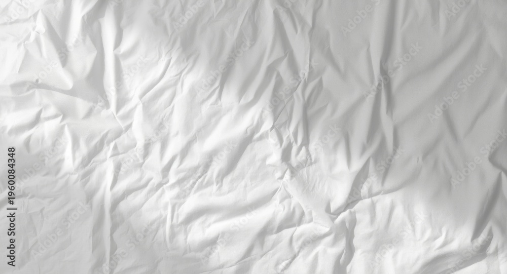 Fototapeta premium Crumpled white table cloth surface with gentle highlight